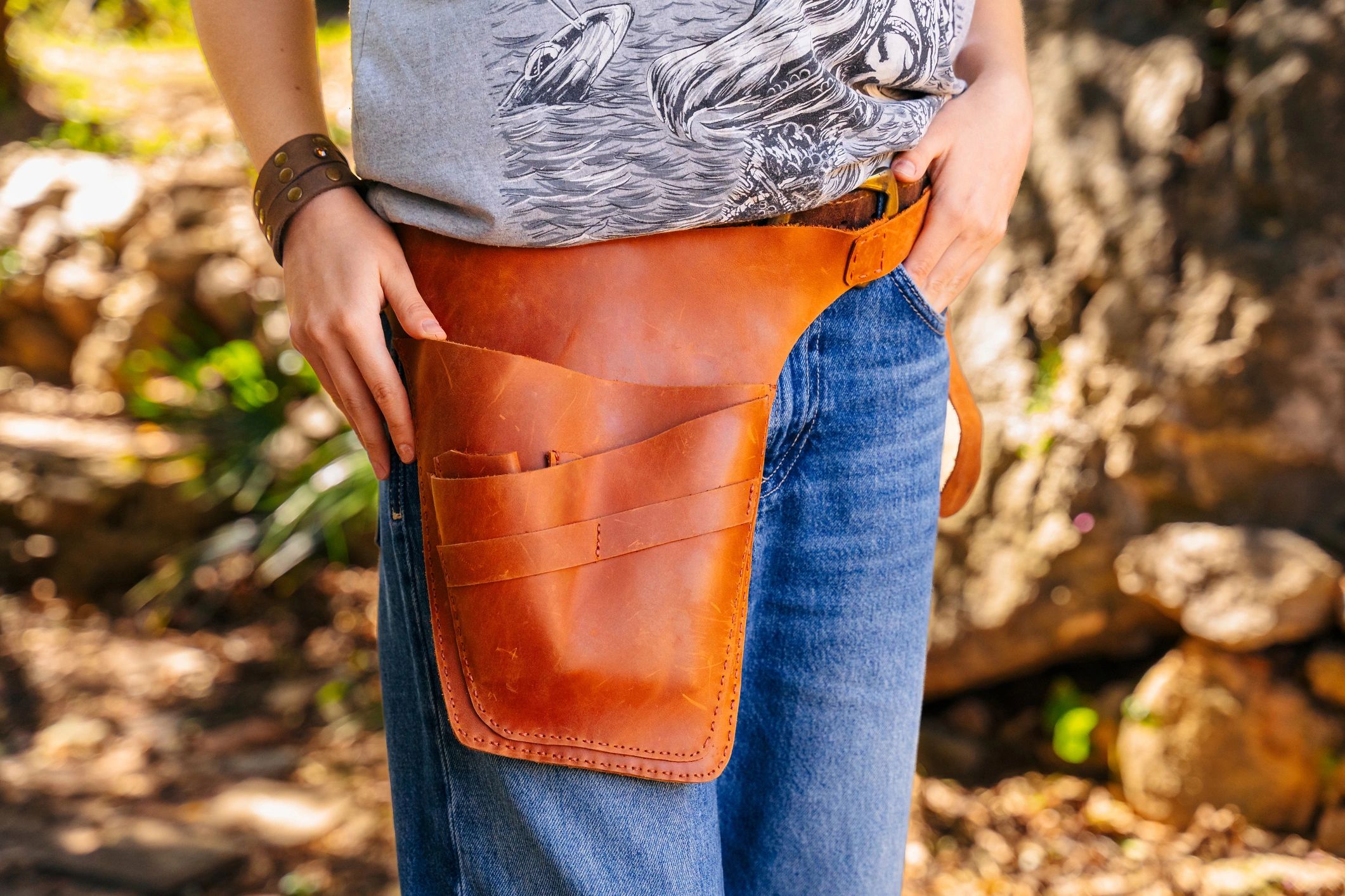 Handmade leather utility pouch on jeans
