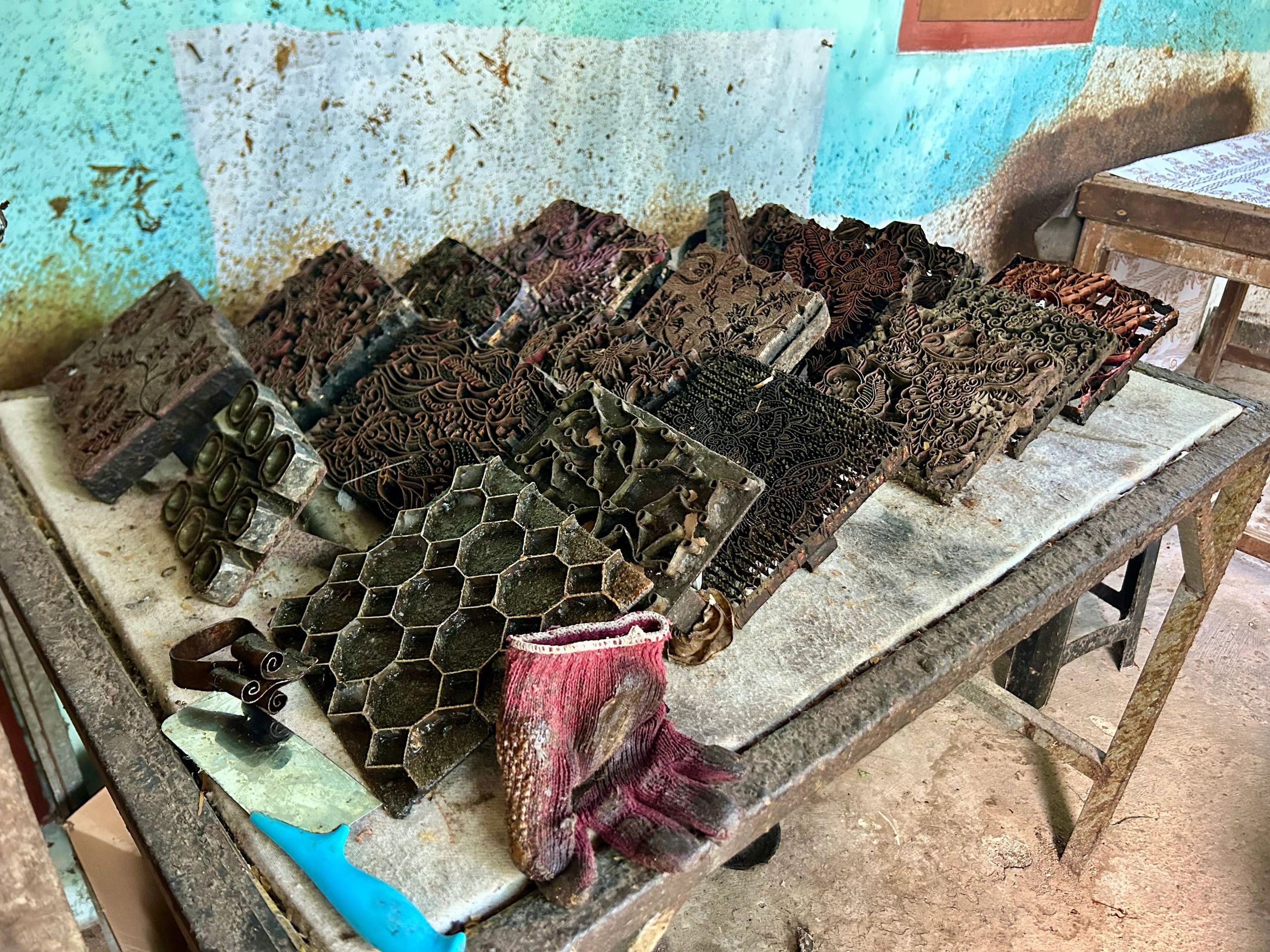 Craft tools and display items arranged on a workshop table